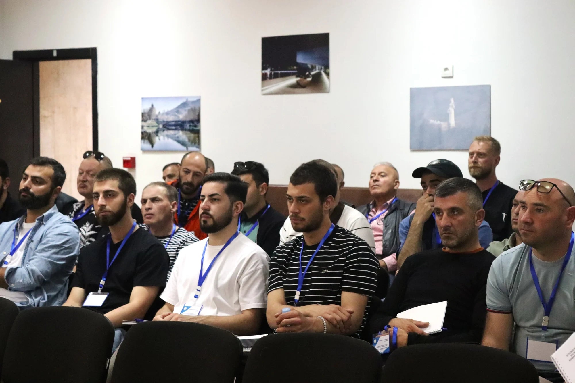 Dog muzzle and gear laid out flat, featuring tan and black colors, including adjustable straps and soft mesh interior.