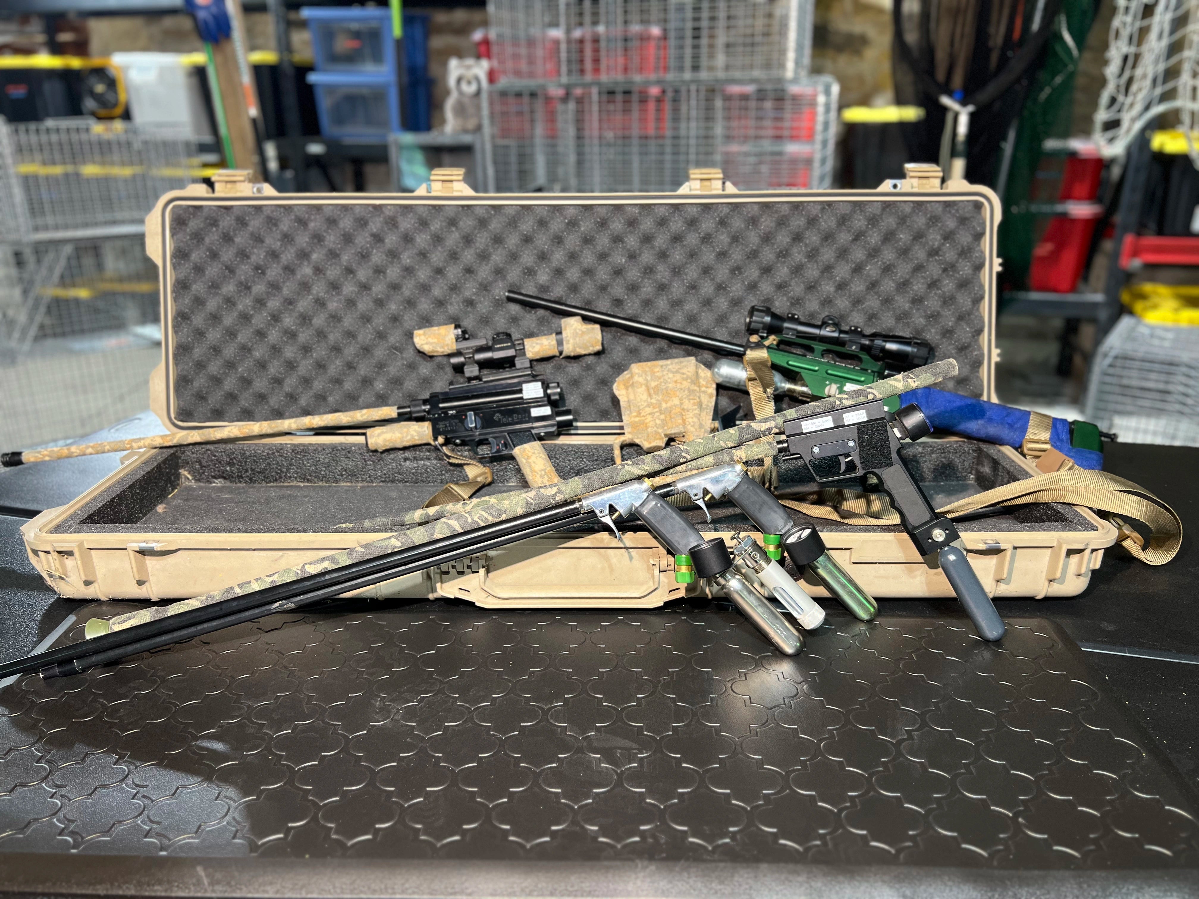 Dog muzzle in tan displayed on white table surface, showing close-up of breathable mesh and sturdy construction.