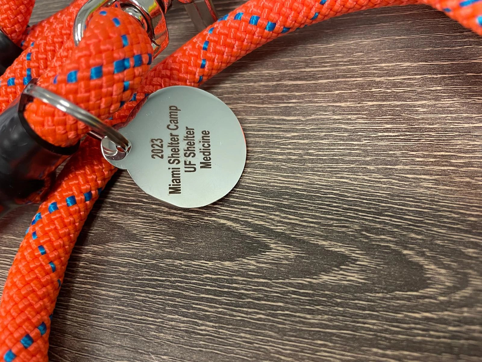 Multiple UF leashes coiled together in various colors and styles, made with durable materials for reliable animal control use.