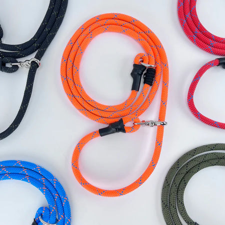 Tan dog muzzle placed on a table, showing Humane Innovations’ durable, well-ventilated design made for comfort and secure fit.